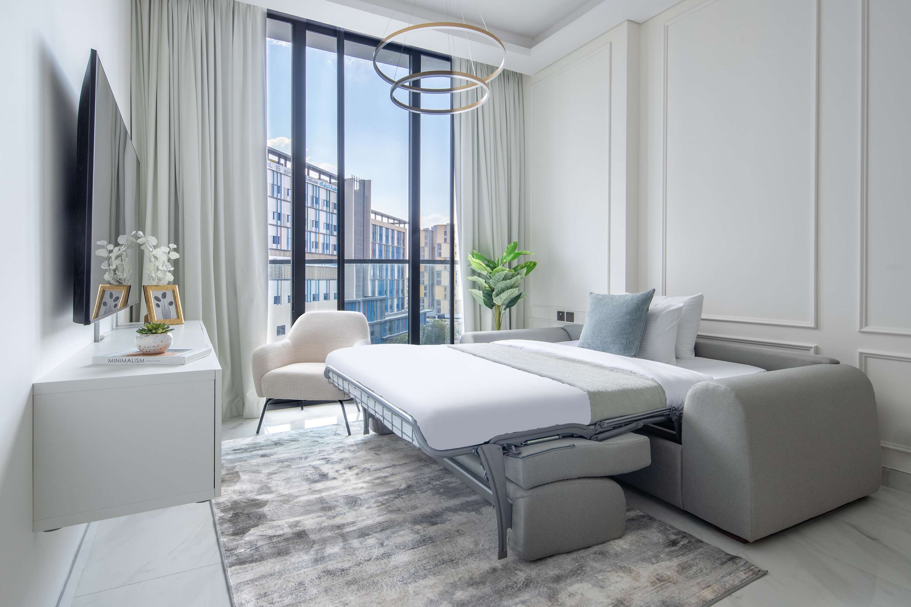 comeover sofa bed converted into a bed in a 1-bedroom holiday home Dubai Downtown apartment