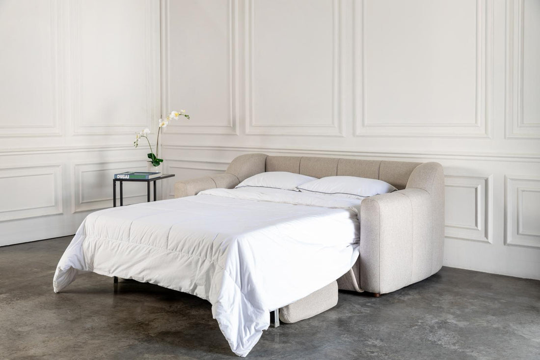 comeover sofa bed converted into a bed with hospitality grade white bedding