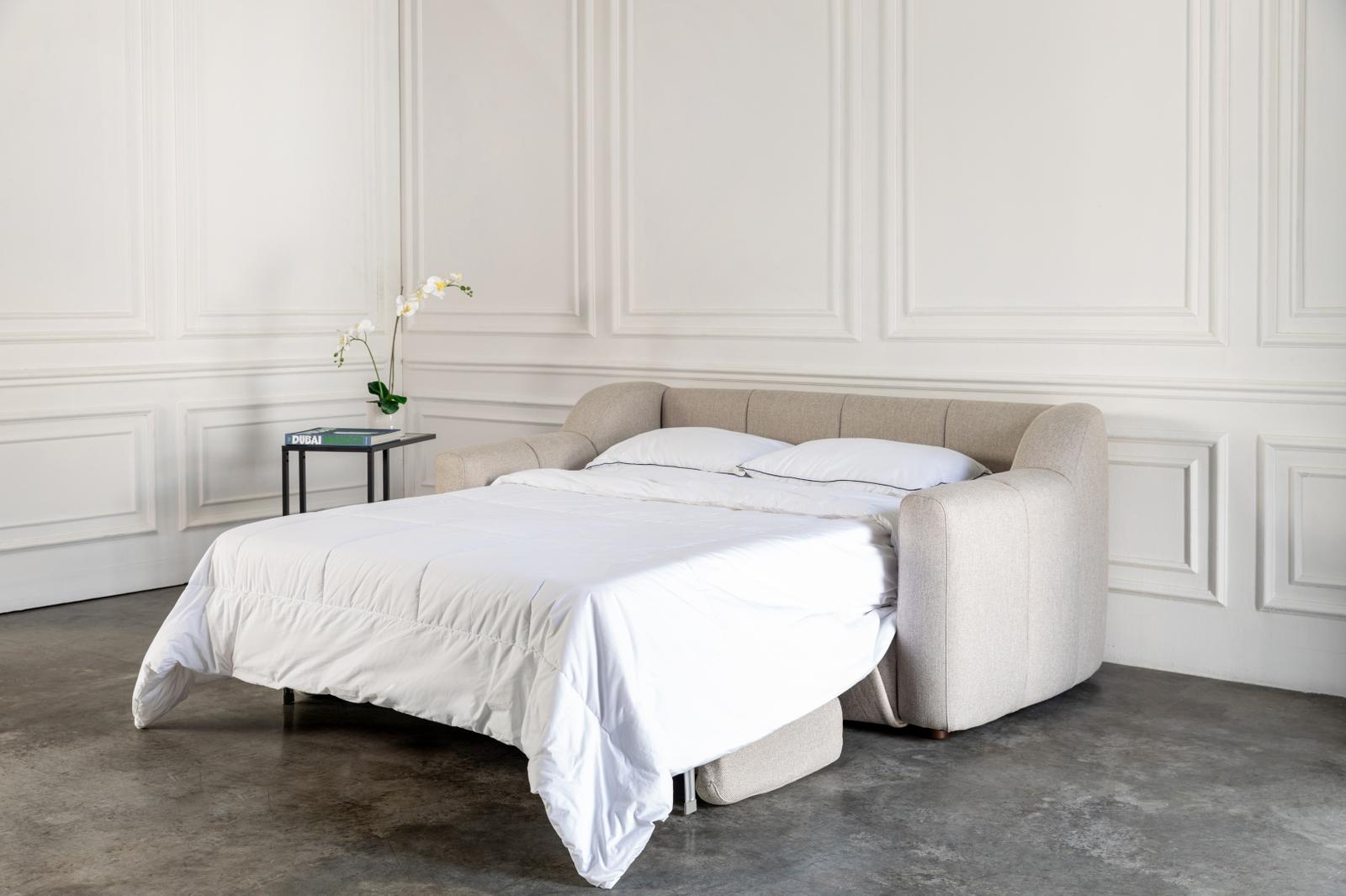 comeover sofa bed converted into a bed with hospitality grade white bedding