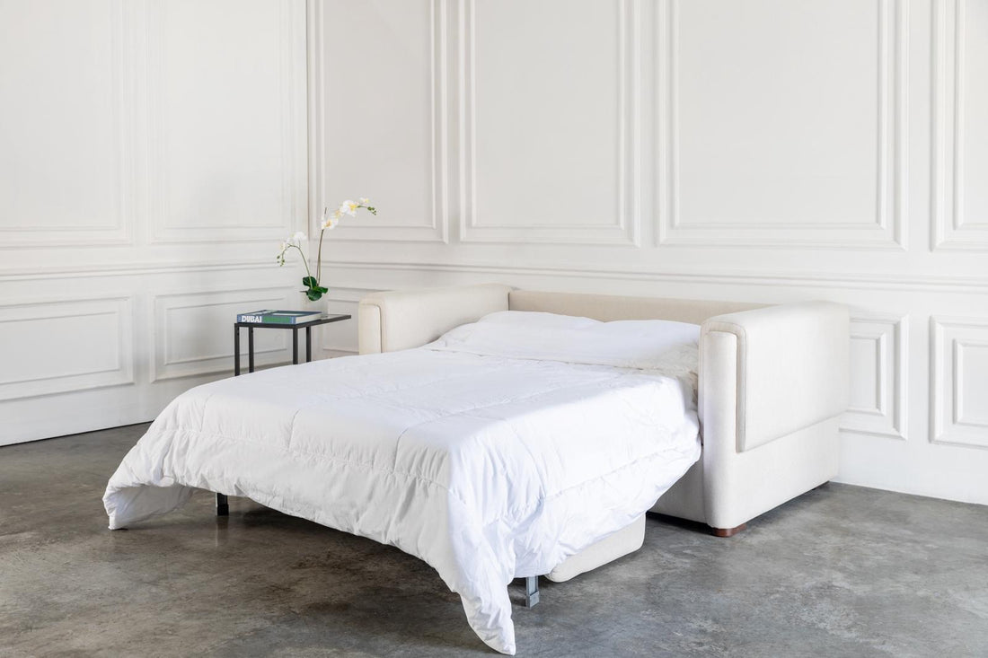 comeover sofa bed converted into a bed with hospitality grade white bedding 