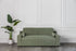 comeover green modern sofa bed design in a room with white walls and a plant.